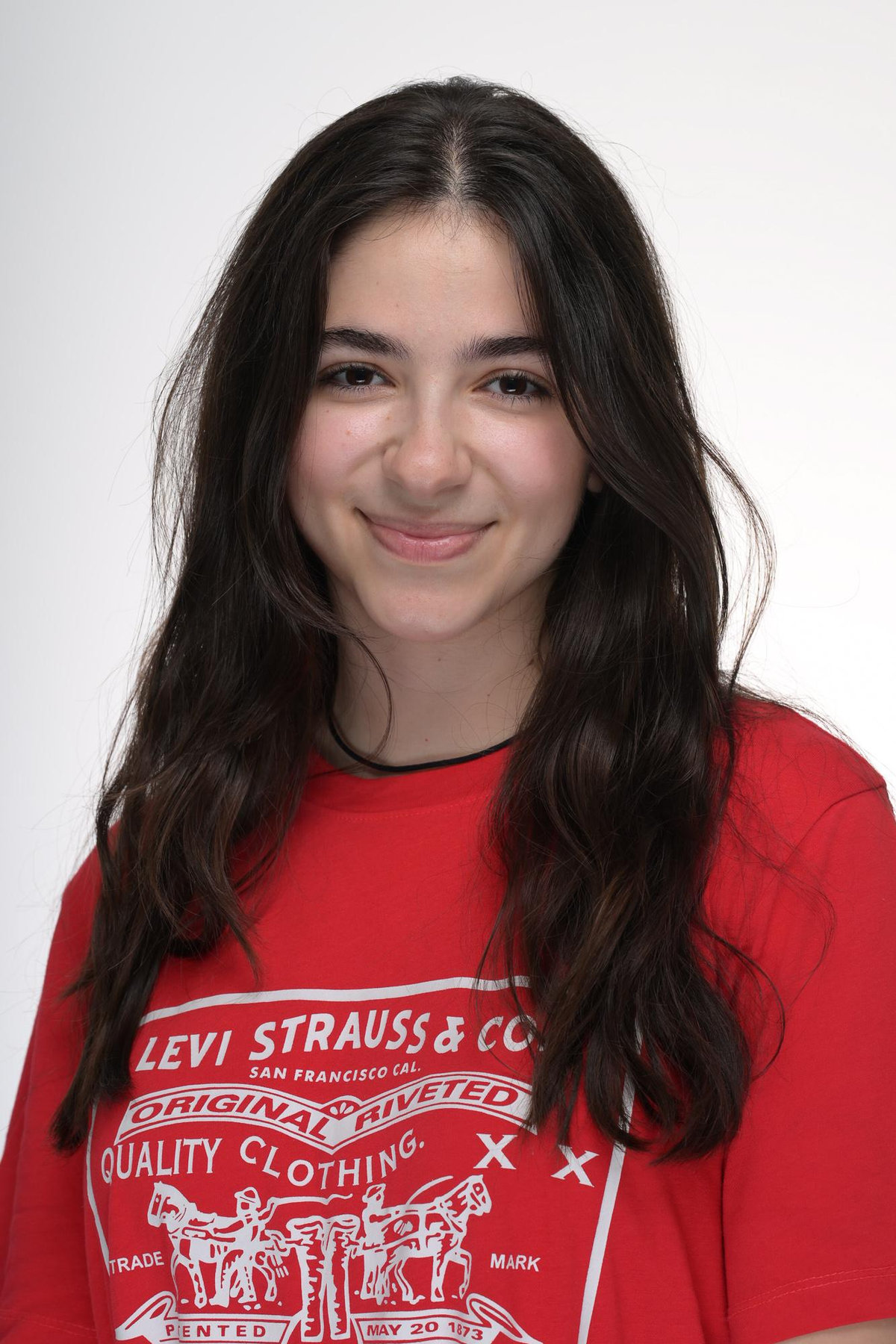 Stefanie smiling in a red shirt